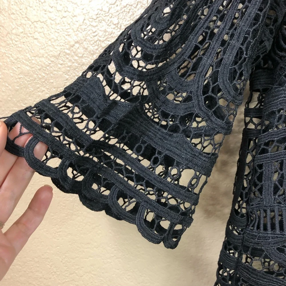 Goldie crocheted lace v neck flare sleeve top.